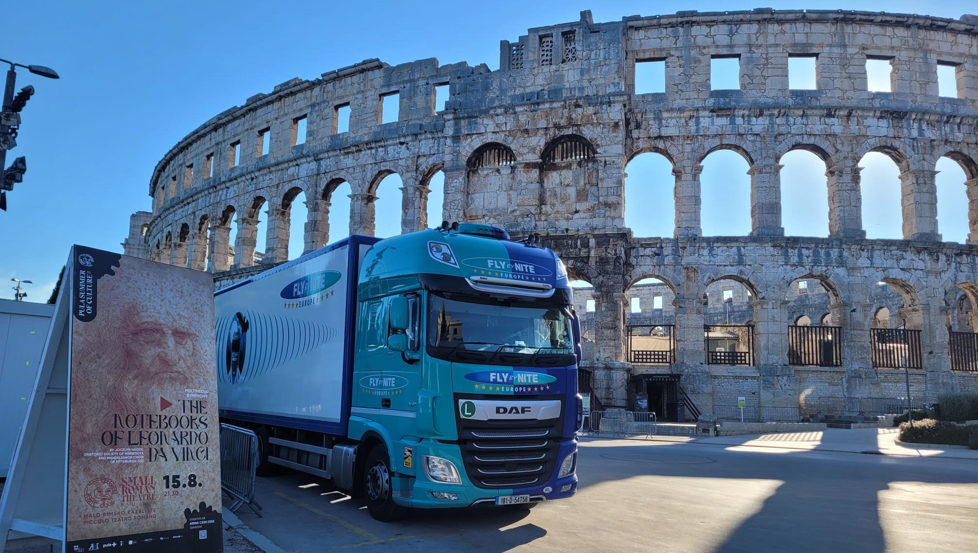 Fly by nite truck - Rome - We’ve all enjoyed our favourite artists performing in packed arenas or at summer festivals. But, every tour, every show and every set relies on a hidden network of vehicles, drivers, and meticulous planning — and Fly by Nite has been orchestrating this complex logistics puzzle since 1989. They are the trusted logistics partner for some of the biggest names in music, entertainment, corporate events, and exhibitions. From their 8-acre West Midlands base — which includes 4,100 sqm of temperature-controlled warehousing — Fly by Nite manages over 200 vehicles and 270 trailers, operating across the UK, Europe, the Middle East, and North Africa. Their mission is clear: transport every piece of equipment safely and efficiently, from start to finish - to keep the show on the road, pardon the pun. Supporting drivers and building a strong team culture Luke Price’s journey reflects Fly by Nite’s values. Joining as an assistant to the Transport Manager in 2016, he progressed to Compliance Manager in 2019 and became Transport Manager in April of this year. “At the heart of everything is a drive to provide the best possible service,” says Luke. “We’re a close-knit team that demands the best from each other, and CameraMatics helps us support our drivers every step of the way.” Long tours, irregular schedules, and extended periods away from home make driver support essential. Fly by Nite invests in its people, building a culture of accountability, safety, and teamwork — with technology like CameraMatics embedded into daily operations. The challenge of managing a busy, global fleet “Working in live events is unpredictable and fast-paced,” Luke explains. “One day you’re at an arena in Amsterdam, the next on a muddy festival site in the UK. Despite the long hours and irregular schedules, our drivers deliver service that is second to none.” Tour schedules are meticulously planned, but even minor changes can have big knock-on effects. “During a recent Post Malone tour, a tube strike in the UK forced a show to be rescheduled. These changes impact everything — transport, loading, and timing — but as the saying goes… the show must go on.” Every delay or mistake has serious consequences. Tours cost millions to run, and operational risks such as theft, accidents, or non-compliance can disrupt schedules, compromise driver safety, and damage Fly by Nite’s hard-earned reputation. In this high-pressure environment, every journey matters, and every decision counts. Full visibility, total control Operating across major London venues such as Wembley, the O2, and the Royal Albert Hall, Fly by Nite needed a system that met the Direct Vision Standard (DVS) to operate legally and safely. International tours added further complexity — the team required a reliable solution with a strong global network to provide full visibility, live GPS tracking, and instant access to camera footage wherever vehicles were. Fly by Nite chose CameraMatics 360, a fully integrated telematics and camera system with forward-facing and side cameras, certified for DVS compliance. The AI-powered system keeps drivers safe on long journeys by detecting risks and alerting them in real time, giving the team full visibility and control over every journey. “We’ve been with CameraMatics for a few years now, and it’s one of the best decisions we’ve made,” Luke says. “The system is sleek, user-friendly, and gives us much more data on driver behaviour, safety, and vehicle performance. The real game-changer is being able to log in remotely — wherever the vehicles are, we have full visibility and can respond instantly if anything goes wrong.” Drivers responded positively too. “They know the cameras are there to help, not hinder. It gives them extra protection and peace of mind,” adds Luke. # Real results: safer driving, faster response, less downtime Since adopting CameraMatics, Fly by Nite has seen significant improvements across their operations. Risky driving behaviours like speeding, harsh braking, and distracted driving have reduced dramatically. “We’ve noticed drivers take much more care behind the wheel,” Luke explains. “We often complete driver debriefs where we can show them where they are and where they can improve — we look at speeding events, harsh braking, camera footage and telematics data. Once drivers have seen the figures and footage, they’re much better equipped to make improvements.” Downtime and maintenance costs have fallen, thanks to real-time system health updates that enable proactive maintenance and early fault detection. Incident response is faster than ever. Remote access to live footage allows accidents, suspicious activity, or complaints to be addressed immediately, no matter where in the world the vehicle is. “The biggest difference has been the speed and visibility,” Luke says. “Previously, we’d have to wait for a vehicle to return before reviewing an incident. Now we can log in instantly, see exactly what happened, and take action straight away. It’s transformed how we manage safety and accountability across the fleet.” A recent example highlights the system’s value. On a tour in Sweden, a suspicious individual tried to access parked trucks. A driver alerted the team, and Luke immediately accessed the camera footage, capturing clear images of the person and their vehicle registration. Authorities intervened quickly and recovered stolen items — an outcome that would not have been possible without CameraMatics. More than technology: a partnership that works For Fly by Nite, CameraMatics is more than technology — it’s a partnership. “What stood out to us from the start was the people and the service — we knew instantly this would be a great fit. The system and online portal are intuitive, comprehensive, and always improving. CameraMatics is forward-thinking, and their passion for road safety aligns perfectly with our own values.” Peace of mind from warehouse to venue In live events, there’s no room for mistakes. Every tour, every venue, every load counts. With CameraMatics, Incidents are addressed instantly, risky driving is reduced, and downtime is minimised — protecting Fly by Nite’s equipment, teams, and timelines — keeping every tour on track.